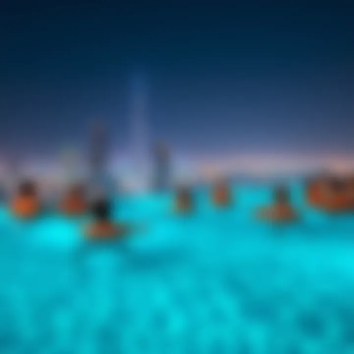 Residents enjoying the rooftop pool at Shatha Tower with cityscape backdrop